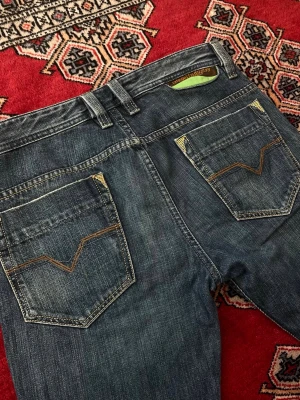 Vintage Diesel Safado Jeans - Vintage Diesel Safado Jeans.  With cool green details.  They are like brand new!  Size W29 L34.  Outer leg lenght 92cm Waist width 42cm  If you have any questions or offer, let me know:)  