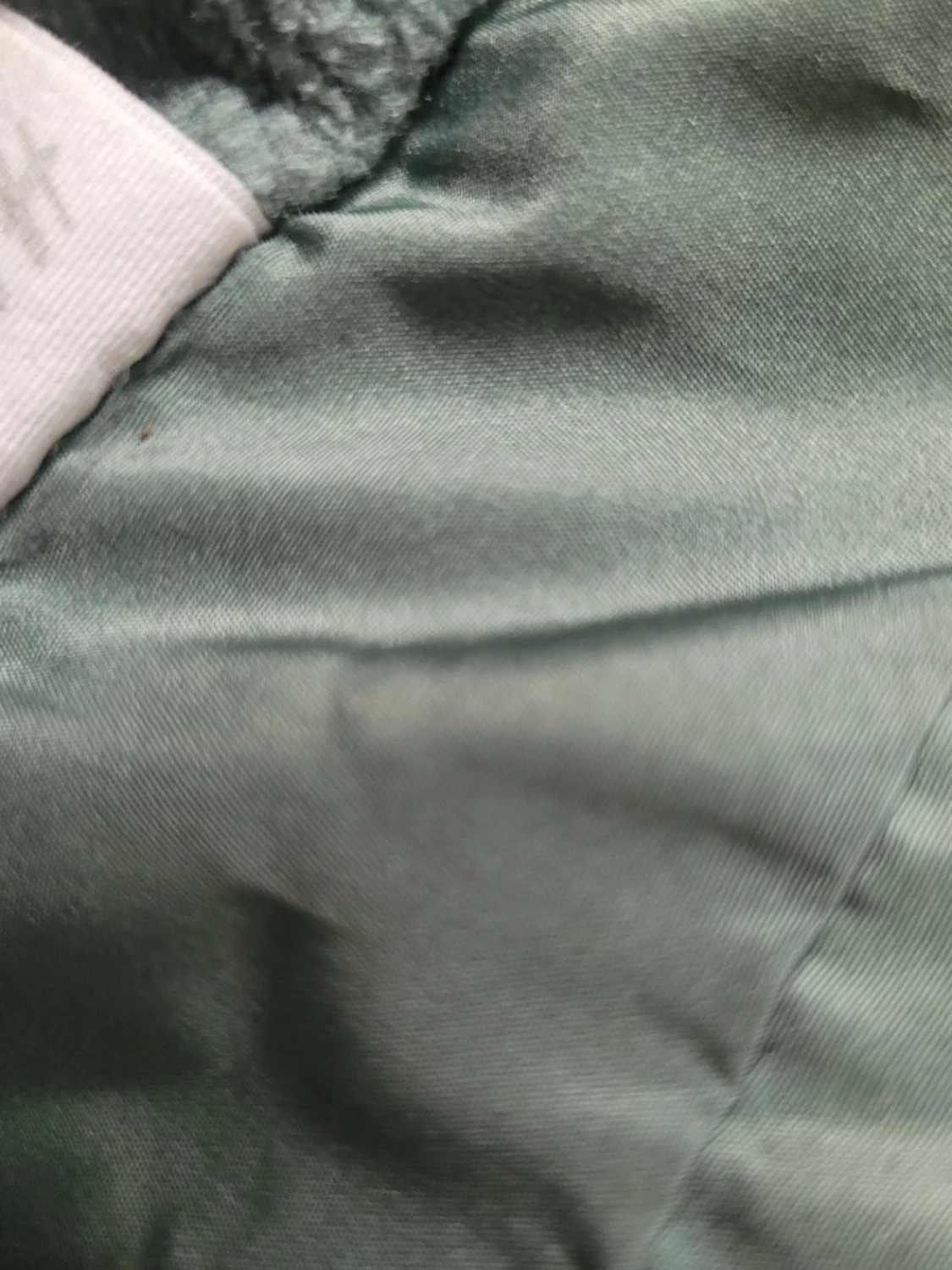 Grön jacka med Musse Pigg-motiv