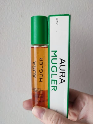 Mugler Aura - Aura Mugler Perfume. 33ml bottle. New! The box has some small tears great all year around fragrance.