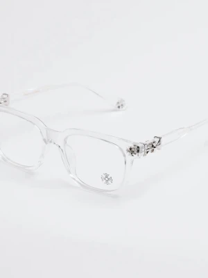 Chromehearts glasögon helt nya - Säljer ett par trendiga transparenta glasögon med rektangulära bågar och coola silverdetaljer vid gångjärnen. Glasögonen har en modern och stilren look som passar dig som vill sticka ut. Materialet är plast och metall.