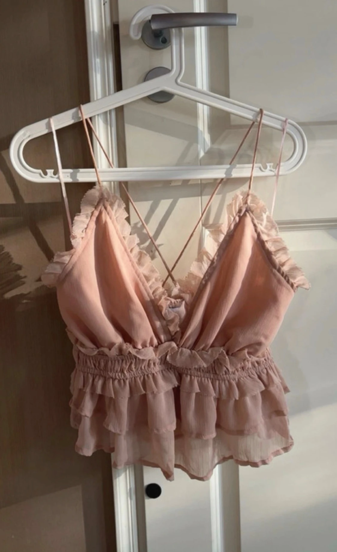 Ljusrosa volangig linnetopp