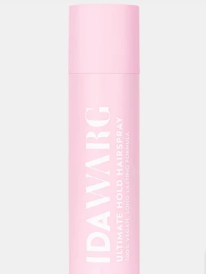 Ida Warg Ultimate Hold Hårspray - Bra skikt Säljer en rosa hårspray från Ida Warg med texten 'Ultimate Hold Hairspray'. Flaskan är cylinderformad och har en stilren design. Produkten är vegansk och har en långvarig formula som ger stark stadga till håret.