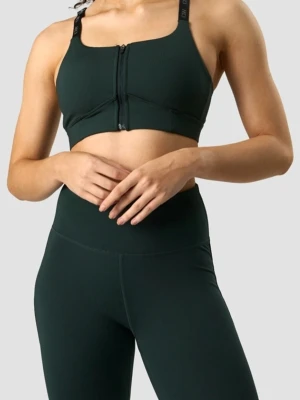 Mörkgrön sport-bh & tights från ICANIWILL - Sport-bh i mörkgrönt från ICIW med dragkedja framtill och justerbara axelband. Bh:n har bred resår under bysten och tightsen har även på sidorna resår med ICIW logga. Använt endast engång. Färgen deep grean 