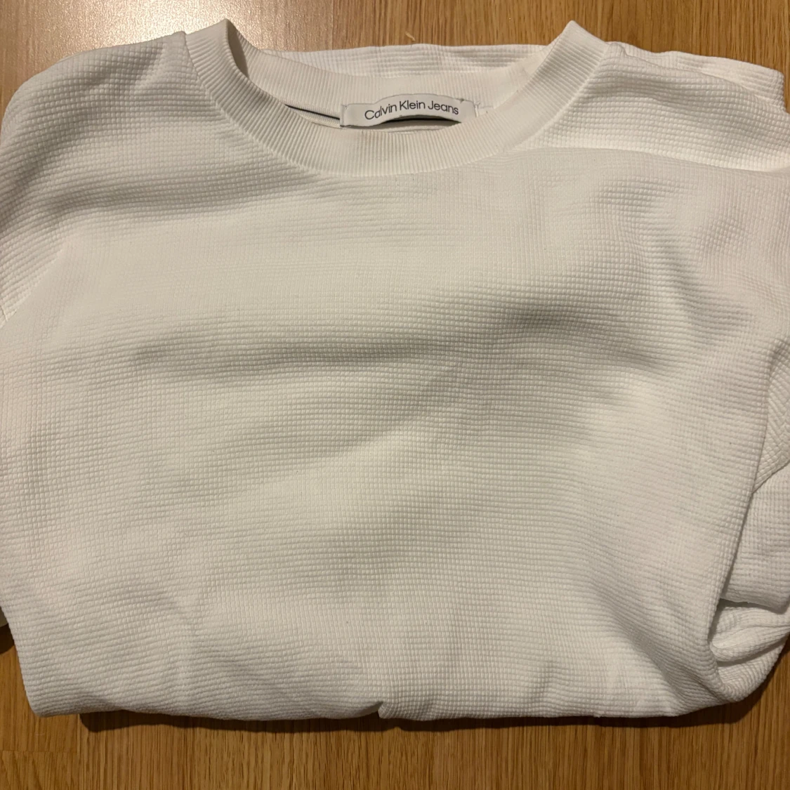 Vit sweatshirt från Calvin Klein Jeans