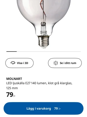 Molnart glödlampa  - LED ljuskälla E27 140 lumen, klot grå klarglas, 125 mm. Som ni ser på bilden SKA glaset vara mörkare, alltså inget fel på glödlampan, jag tycker att ljuset är för varmt därför säljs den! (Suddade ut min spegelbild, lampan är felfri)