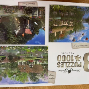 3x1000 bitars pussel + Posters - Country Cottages - Upptäck vackra landskap och charmiga stugor med detta pusselpaket! Ouppackat i orginalförpackning utan prislapp. Innehåller 3 olika pussel och posters med idylliska miljöer.