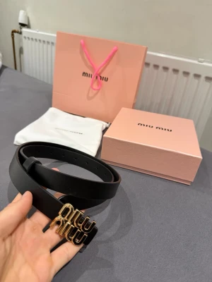 Miu Miu black and Gold belt 105cm - Like brand new. Bought on Vinted with item verification and came out as 100% real. Please send your offers!