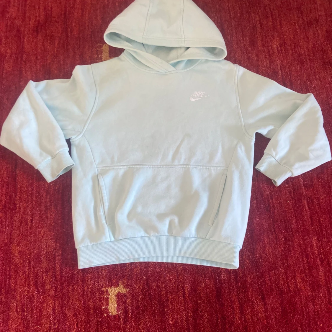 Ljusblå hoodie från Nike