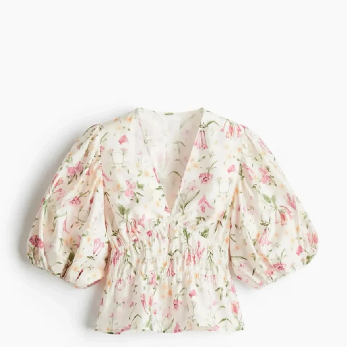 Blommig blus med puffärm från H&M