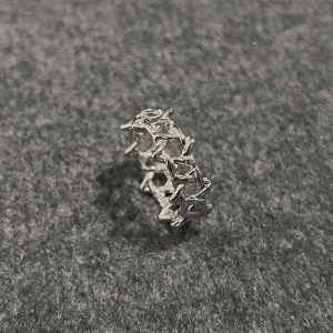 Starwoven - Stainless steel (size 9) with intricate six-pointed star pattern.