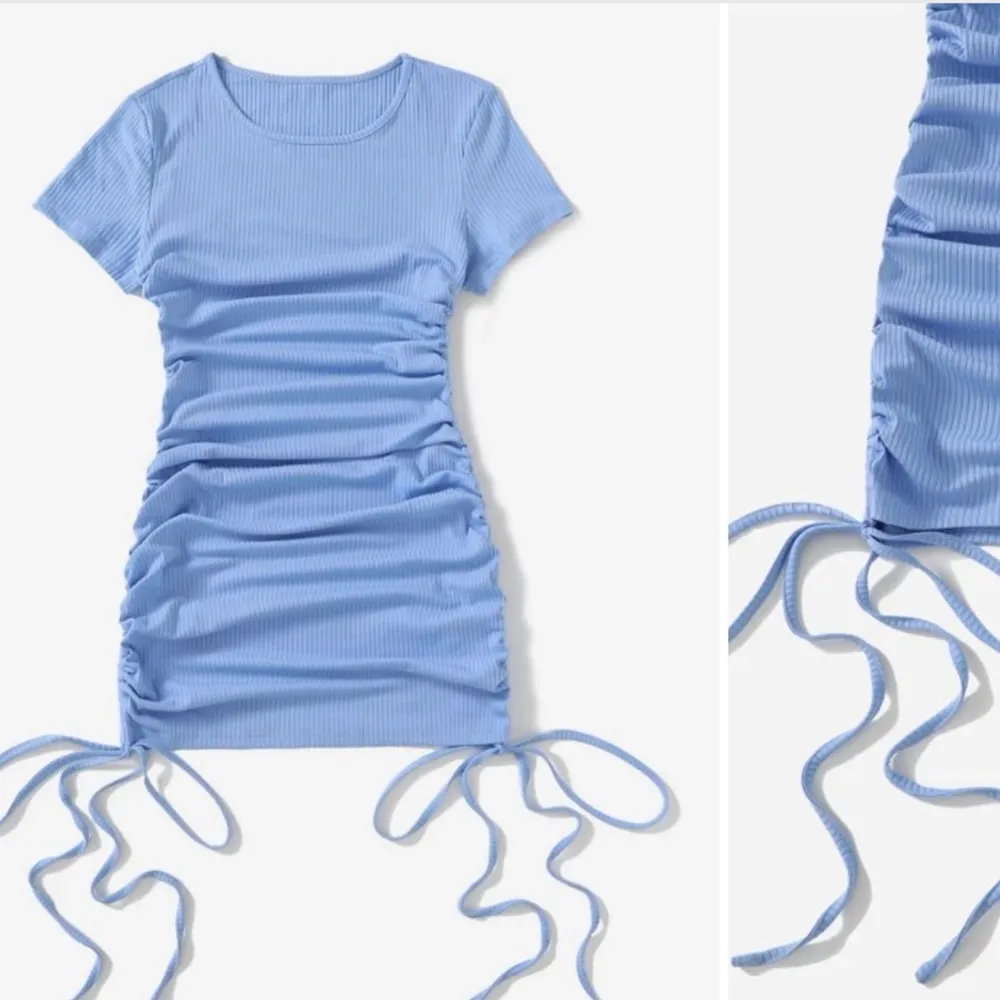 Ribbad babyblå klänning med knut på sidorna. Strl S. Använd 1 gång, en liten fläck som inte syns.. Klänningar.