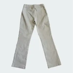 Vita/äggvita stretchiga jeans från Filippa k i storlek s utan fickor bak