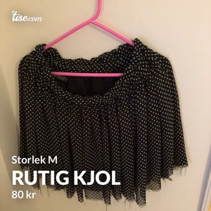 Kjol - En rutig kjol som är uppklippt.