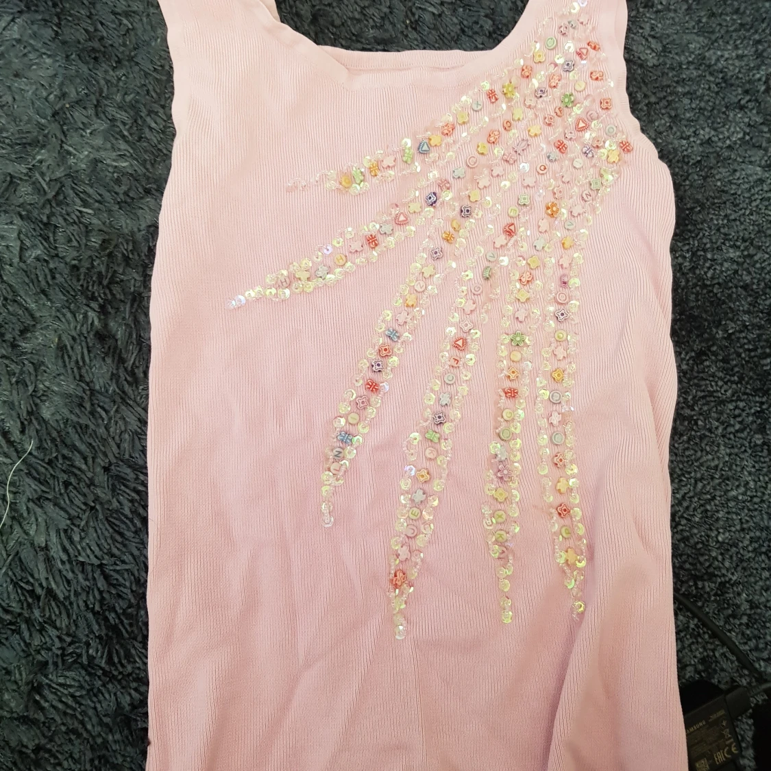 Ljusrosa linne med detaljer