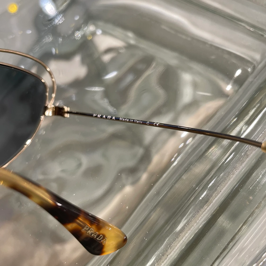 ‘Prada’ sunglasses - 91