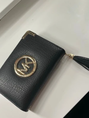 Plånbok  - Säljer då den inte kommer till användning.