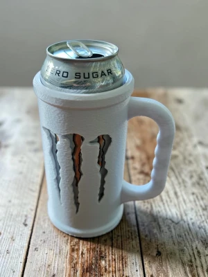 Vit burkhållare till Monster - Säljer en vit burkhållare med handtag, designad för att passa en Monster dryck 
