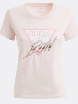 Ljusrosa Guess topp - Snygg ljusrosa T-shirt från Guess med ikonisk trekantslogga och texten 'ICON' i glittriga paljetter framtill. Klassisk rund halsringning och korta ärmar. Perfekt för dig som vill sticka ut med en trendig och bekväm look.