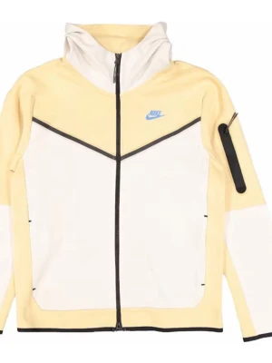 Nike gul och vit hoodie med dragkedja - Nike hoodie i ljusgul och vit färg med svart dragkedja och detaljer. Har huva, blå Nike-logga på bröstet och en praktisk ficka med dragkedja på ärmen. Tillverkad i mjukt material som passar perfekt för en sportig look.
