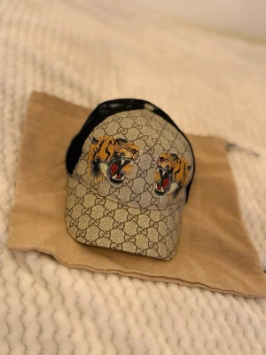 GG keps  - En keps med tiger logo på. Priset kan diskuteras!