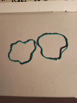 Handmade bracelets - Fake turquoise beads. One black, and one white accent beads. Diameter black ~10cm Diameter white ~11cm  10sek each 15sek for both Bundle discounts: two items 5% off (automatic) three items 10% off, five items 20% off. Message me before purchasing 3+ items for discount.
