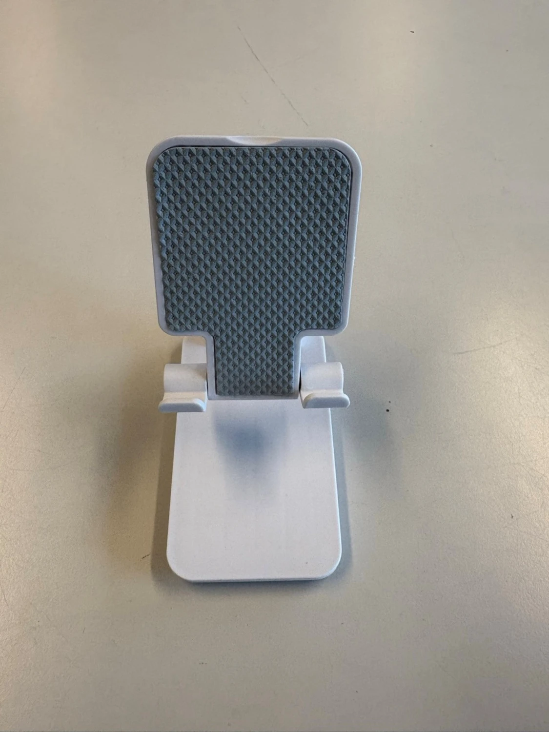 Vikbart mobilställ i vit plast