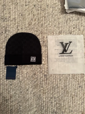 Svart Mössa - En snygg svart mössa som är i nyskick aldrig änvänts