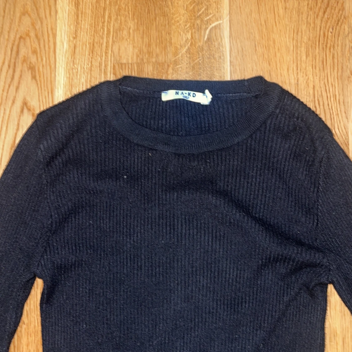 Ribbstickad långärmad topp - 90