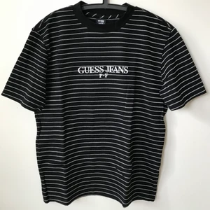 Guess x Places + Faces 3M Reflective Tee - Unisex Guess Jeans x Places + Faces 3M Reflective Striped T-Shirt  Size small, men’s size small / medium fit, slightly oversized.  Great condition, no flaws or damage.  DM if you need exact size measurements.    Buyer pays for all shipping costs. All items sent with tracking number.   No swaps, no trades, no offers. 