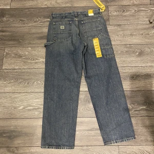Lee jeans - Ett par helt oanvända vintage lee jeans!