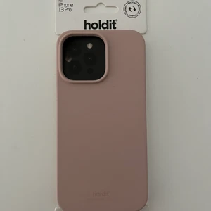 Mobilskal Holdit - Säljer ett holdit skal till en IPhone 13 Pro (färg blusa äh pink). Det är helt nytt då jag köpte fel modell, skicka vid intresse💓💓
