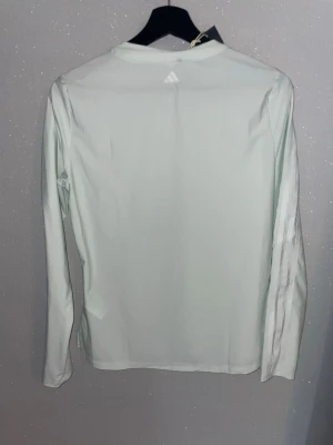 Adidas Sport LS Crew – Ljus mintgrön (långarmad, Dam) - • Ny med tags • Lätt, följsam och fukttransporterande • Nypris: ca 719 kr