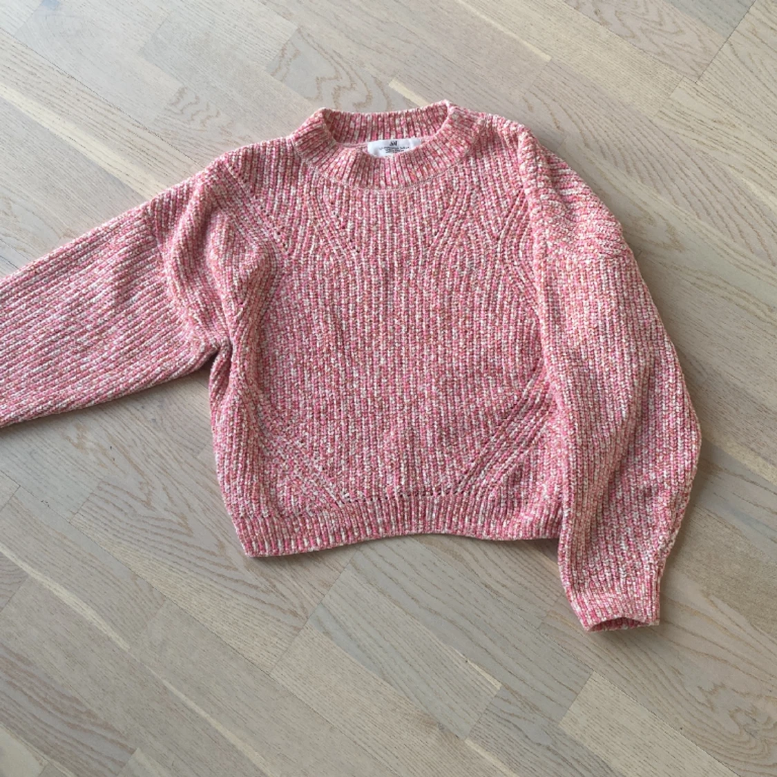 Rosa stickad tröja