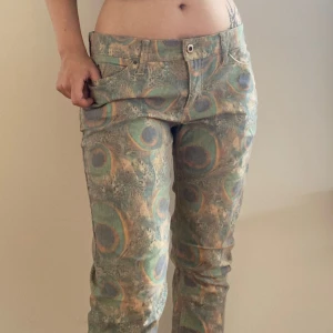 Peacock Print Jeans - Semi loose fitting peacock print jeans. Omly worn for the photos.