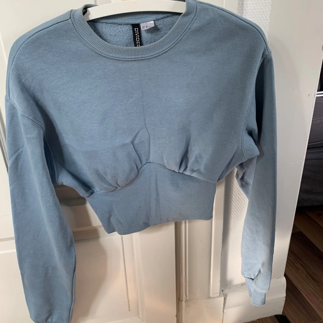 Ljusblå tröja