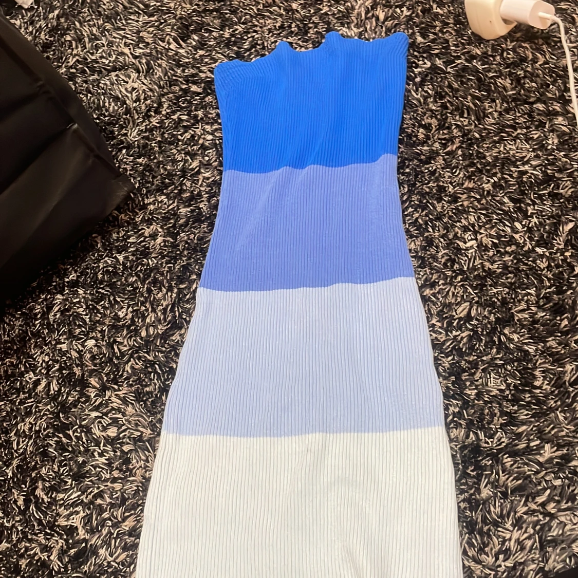 Badeu kläning med blå nyanser