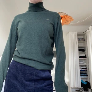 Polotröja mohair  - Polotröja i merinoull i fin grön färg. Något noppig (se bild 3). Xl men sitter som en S.