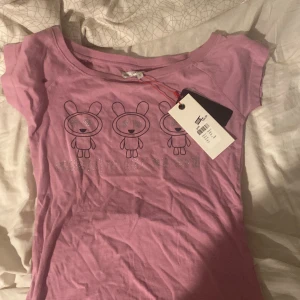 en gulig t-shirt - har inte använt den alls, finns prislapp med