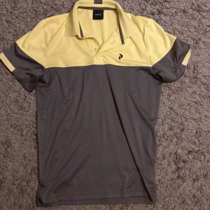 Golfpiké - En Golfpiké från peak performance i storlek S. Köparen står för frakt.