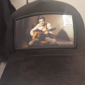 Elvis presly keps limiterad - Den här kepsen är jätte bra skick,andvänd typ 10 gånger. Frakt 49.