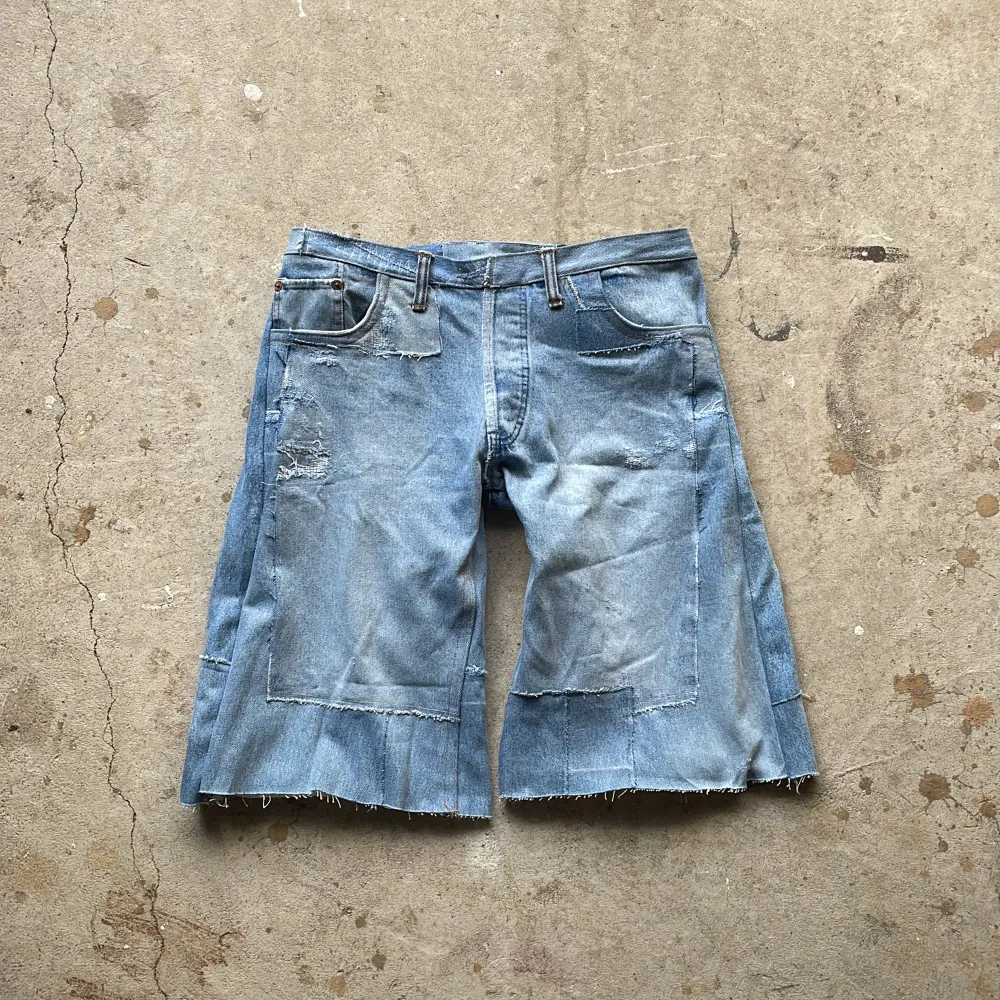 Crafted from vintage denim, this piece features multiple pairs of different jeans entirely reconstructed with a inner lining for comfort.. Shorts.