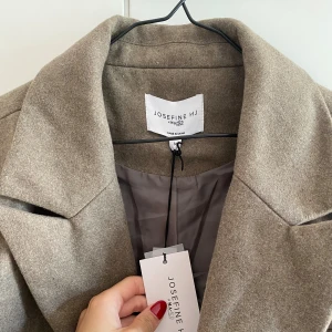 Kappa - Kappa från nakd. Aldrig använd. Lite bredare modell i axlarna, oversized.