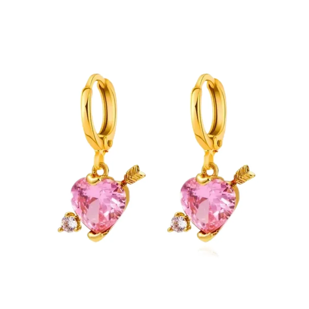 Material: Stainless Steel. Cupid Love Earrings – These enchanting, gold-plated, stainless steel earrings showcase a pair of delicately crafted cupid wings, providing a lightweight and comfortable adornment for any occasion. . Accessoarer.