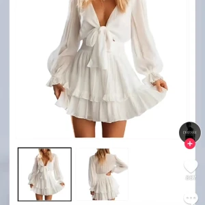 Studentklänning - Populär studentklänning. Aldrig använd. Har en kall ton av vit i verkligheten, ser rosa ut på bilden. Ganska tunt material men man ser inte igenom vid brösten. 