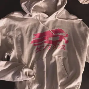 Vit owersized hoodie med neon rosa tryck