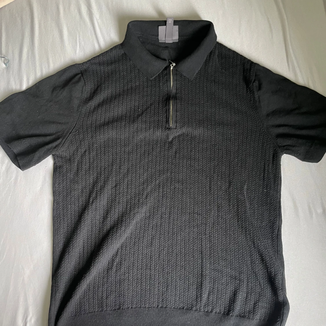 Svart pikétröja med dragkedja från H&M