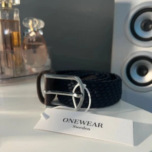 Flätat bälte  - Snyggt bälte från Onewear! Bältet är 70cm. 