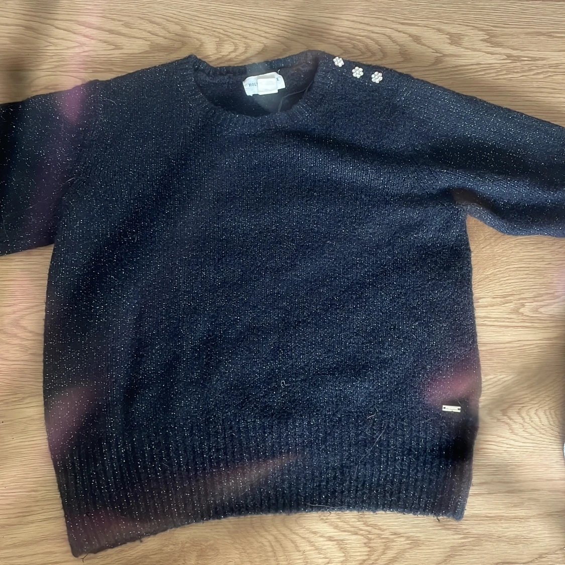 Svart glittrig stickad tröja från Holly & Whyte