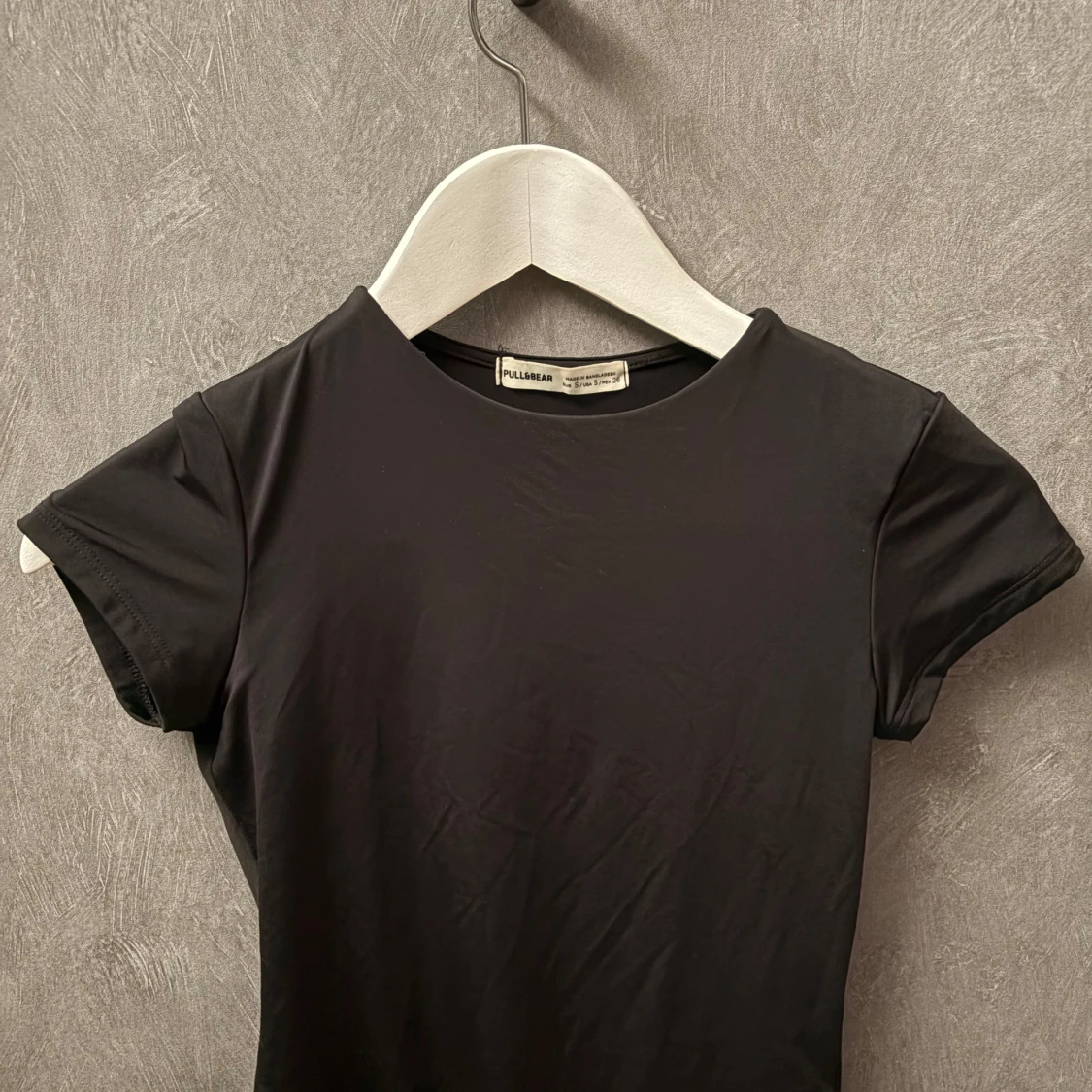 Svart kortärmad body - 1