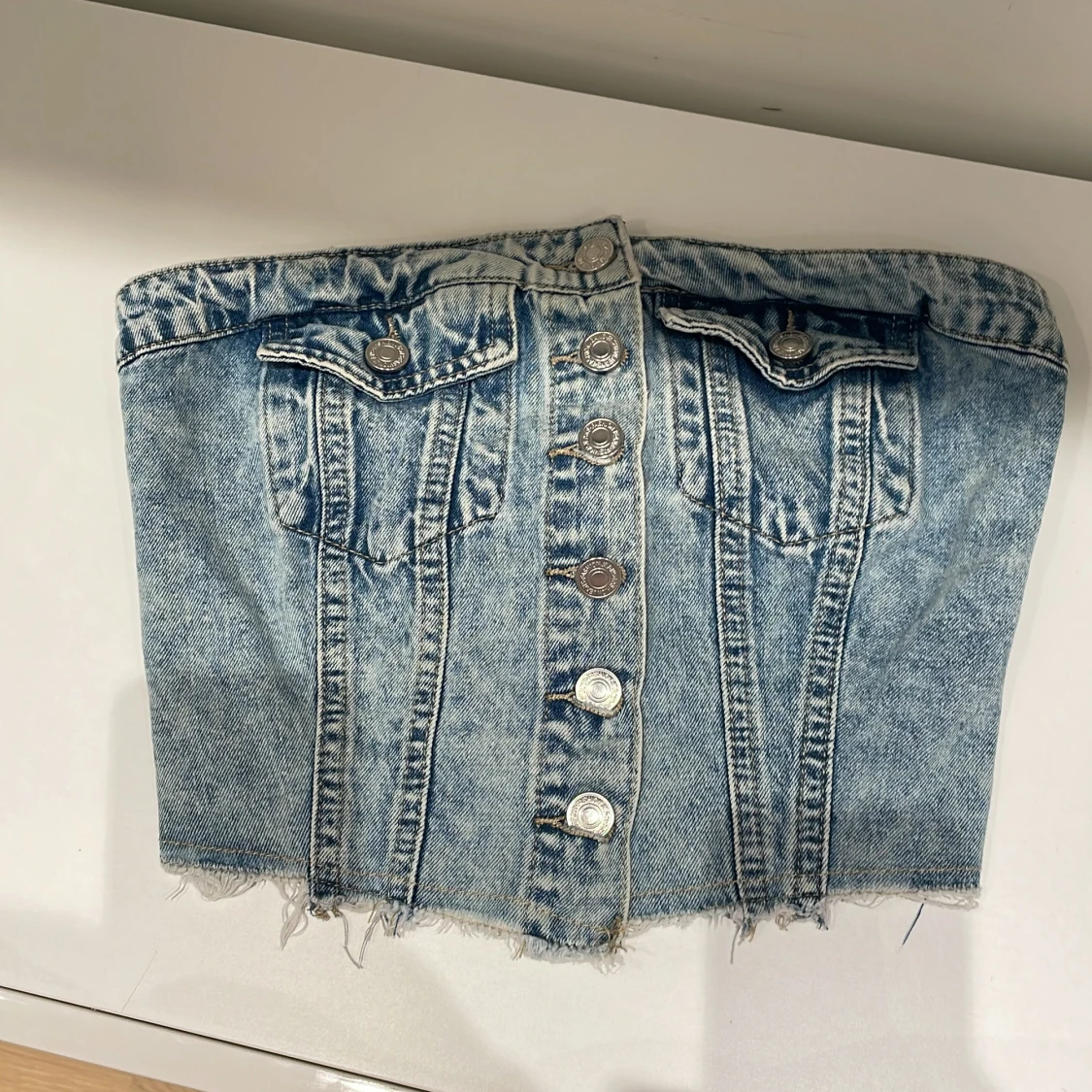 Jeans korsett med knappar, aldrig använt. Storlek XS